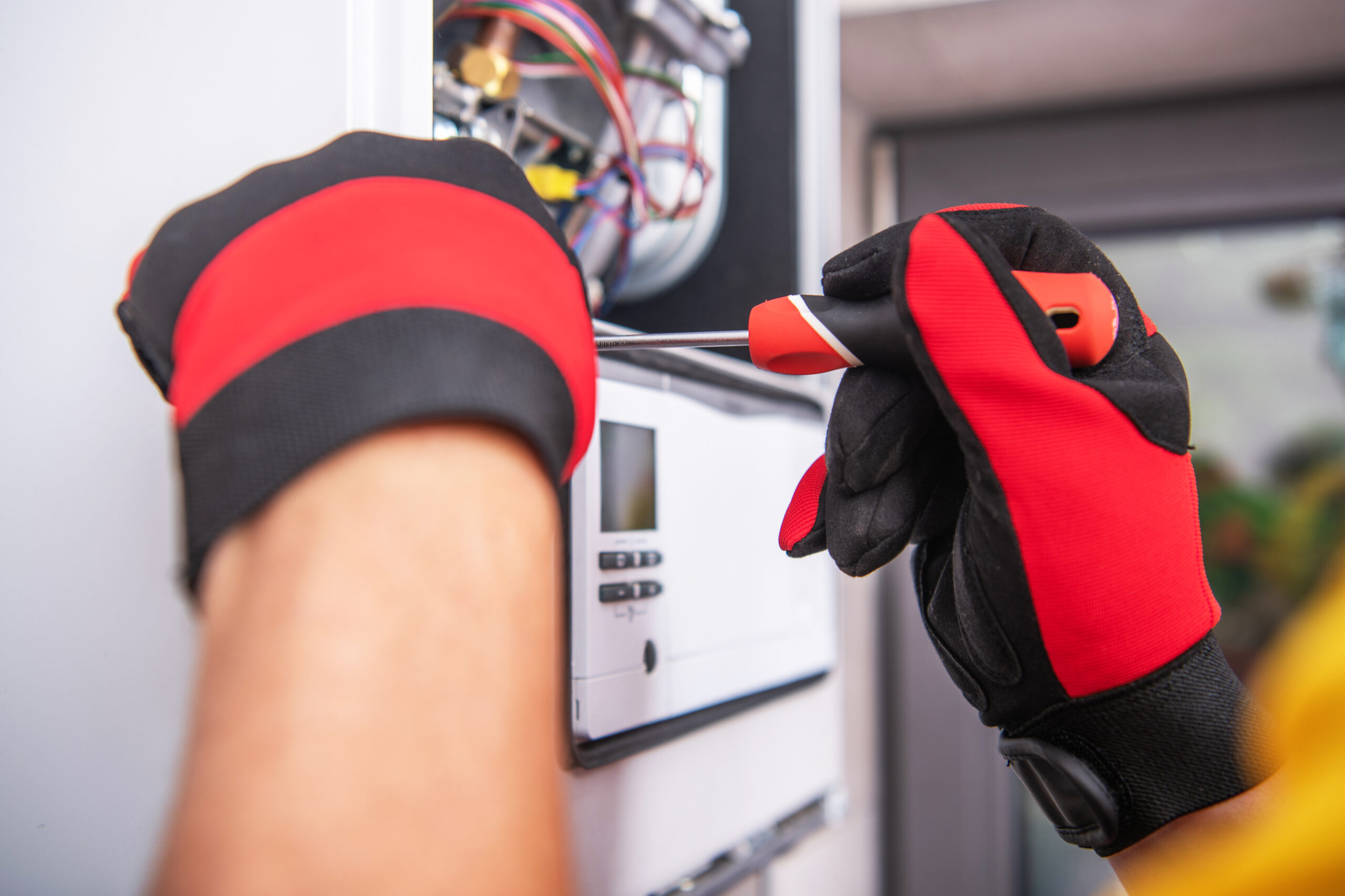 HVAC technician working on equipment